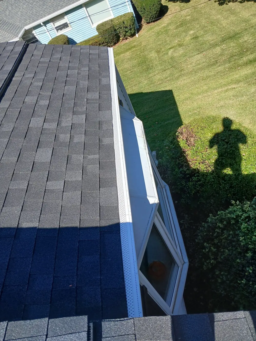 Close look at Onyx Black Duration shingles along the roof edge