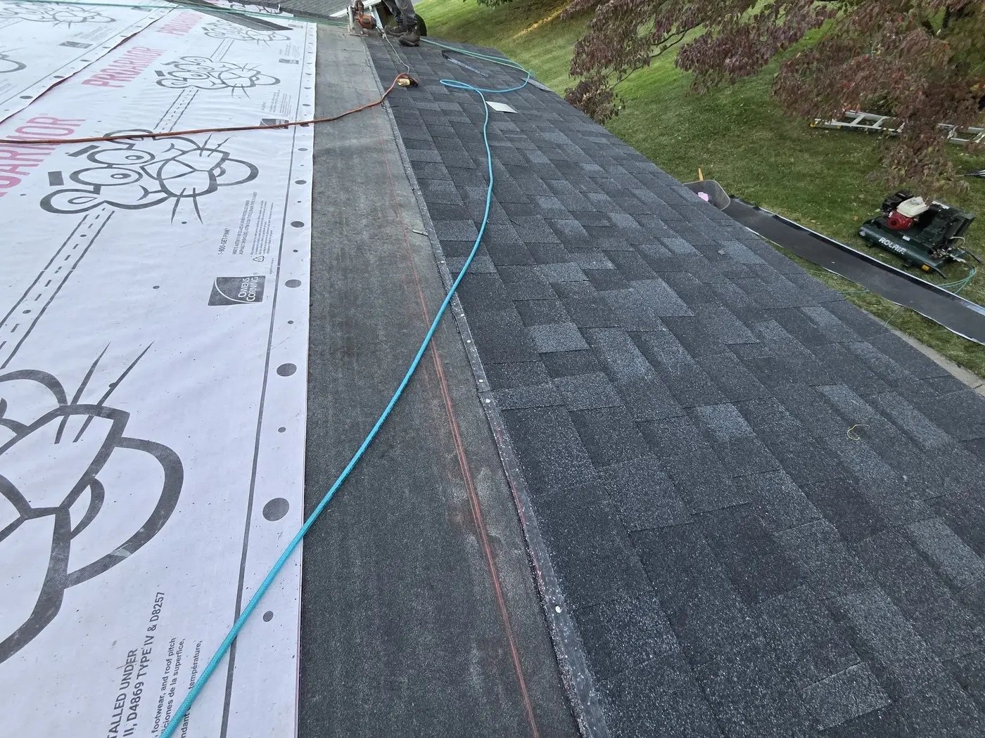Onyx Black Duration shingles going on over new underlayment